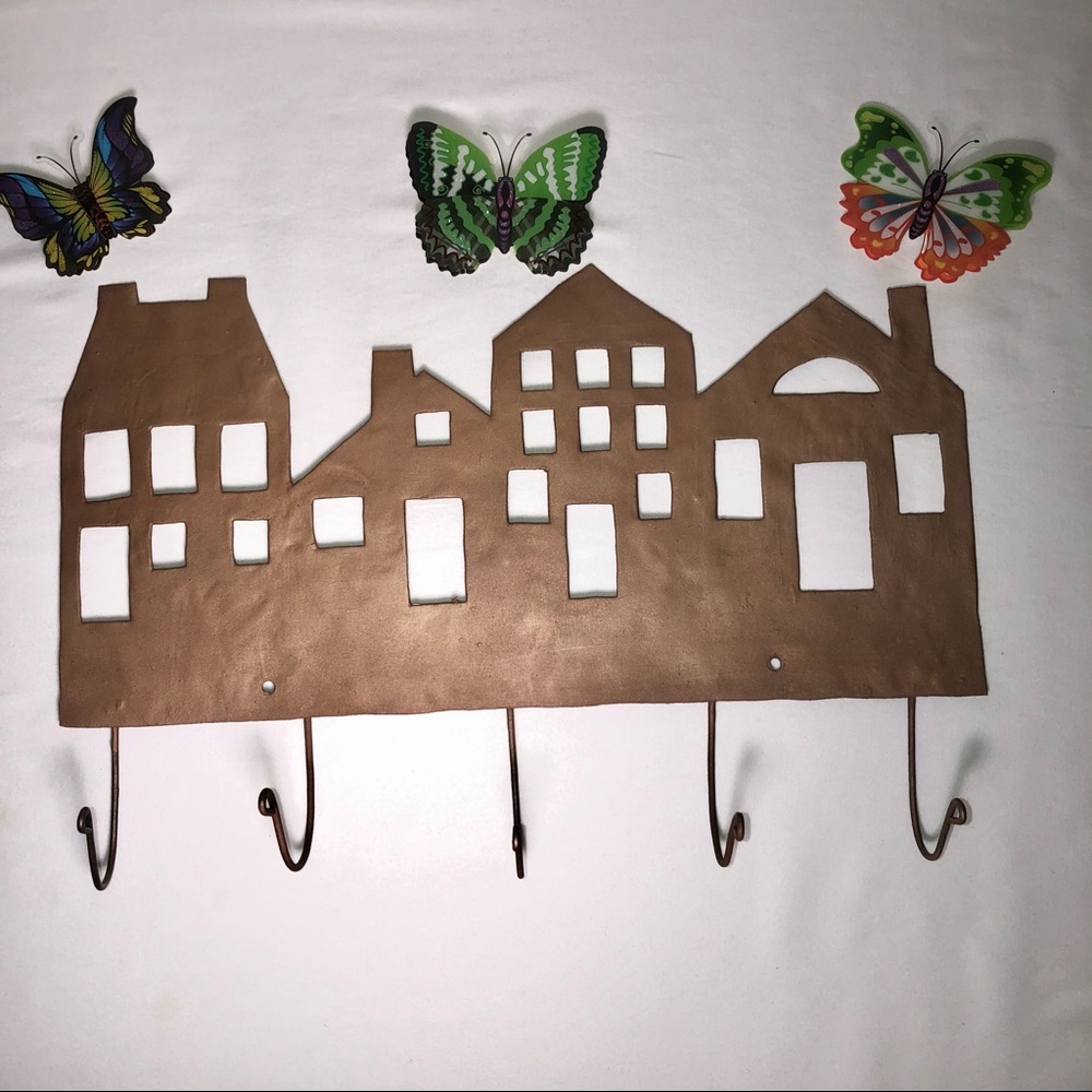 Copper painted metal house wall hanger with hooks, pre-owned